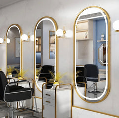 Golden frame oval mirror
