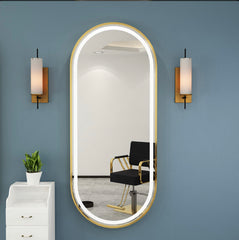 Golden frame oval mirror